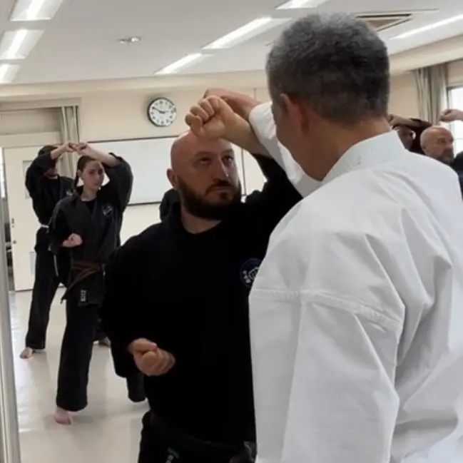 Olgun Tiltay in Nagoya Japan practising kihon [basics] with Hideki Yamada Sensei [9th Dan Shorin-Ryu Karate]